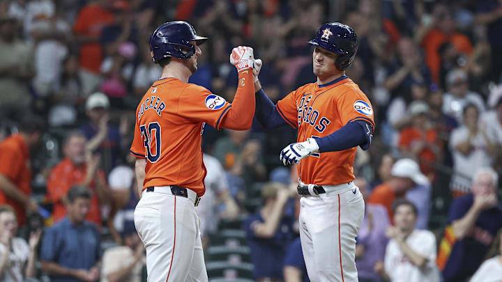 Sep 20, 2024; Houston, Texas, USA; Houston Astros third baseman Alex Bregman (2) celebrates with right fielder Kyle Tucker (30) after hitting a home run during the third inning at Minute Maid Park. 