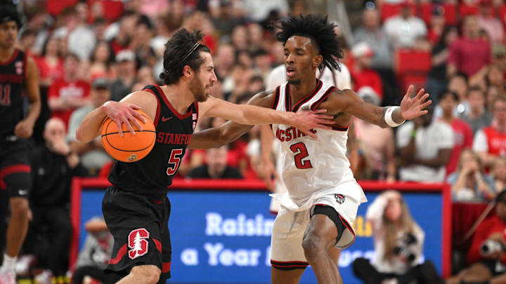 Mar 7, 2026; Raleigh, North Carolina, USA; NC State Wolfpack guard Paul McNeil Jr. (2) guards Stanford Cardinal guard Benny Gealer (5) during the first half at Lenovo Center. Mandatory Credit: Zachary Taft-Imagn Images