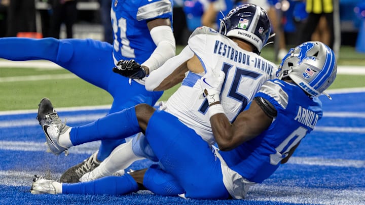 Titans wide receiver Nick Westbrook-Ikhine (15) scores a touchdown and is tackled Lions cornerback Terrion Arnold (0) Titans wide receiver Nick Westbrook-Ikhine (15) scores a touchdown and is tackled Lions cornerback Terrion Arnold (0)