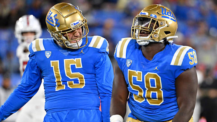 Oct 29, 2022; Pasadena, California, USA;  UCLA Bruins linebacker Laiatu Latu (15) and defensive lineman Gary Smith III (58) celebrate after a sack of Stanford Cardinal quarterback Tanner McKee (18)  in the first half at the Rose Bowl. Mandatory Credit: Jayne Kamin-Oncea-Imagn Images