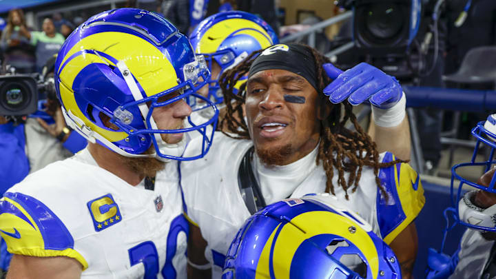 Nov 3, 2024; Seattle, Washington, USA; Los Angeles Rams wide receiver Demarcus Robinson (15, middle) celebrates with teammates, including wide receiver Cooper Kupp (10, left), after catching a game-wining touchdown pass against the Seattle Seahawks during overtime at Lumen Field. Mandatory Credit: Joe Nicholson-Imagn Images