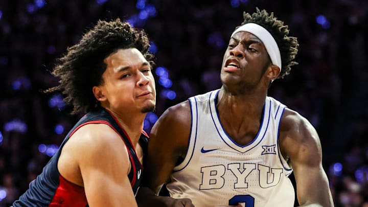 Feb 18, 2026; Tucson, Arizona, USA; Brigham Young Cougars forward AJ Dybantsa (3) dribbles the ball while Arizona Wildcats guard Brayden Burries (5) attempts to block him during the first half of the game at McKale Memorial Center. Mandatory Credit: Aryanna Frank-Imagn Images