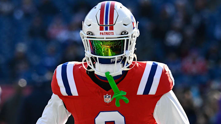 Dec 1, 2024; Foxborough, Massachusetts, USA; New England Patriots cornerback Christian Gonzalez (0) warms up before a game against the Indianapolis Colts at Gillette Stadium. Mandatory Credit: Eric Canha-Imagn Images