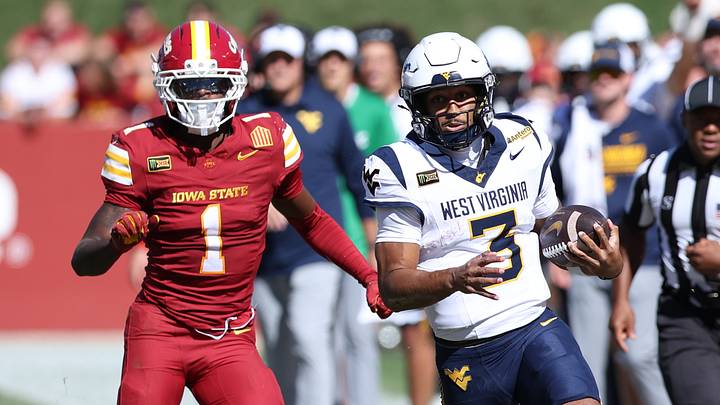 Oct 3, 2026; Ames, Iowa, USA;  Iowa State Cyclones cornerback Keyon Washington (1) chases West Virginia Mountaineers quarterback Michael Hawkins Jr. (3) at Jack Trice Stadium.  Mandatory Credit: Reese Strickland-Imagn Images