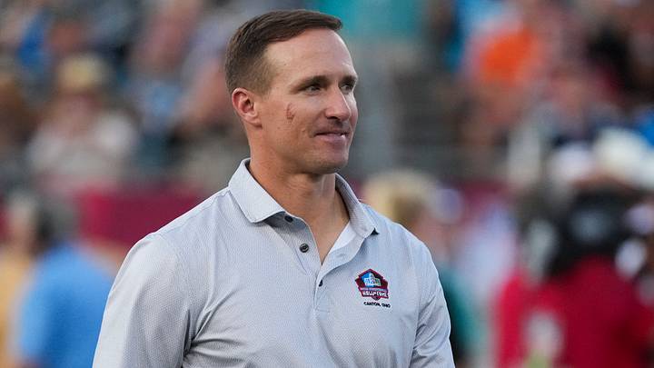Aug 6, 2026; Canton, Ohio, USA; Professional Football Hall of Fame enshrinee former New Orleans Saints quarterback Drew Brees in attendance prior other the game between the Arizona Cardinals and the Carolina Panthers at Tom Benson Hall of Fame Stadium. Mandatory Credit: Kirby Lee-Imagn Images
