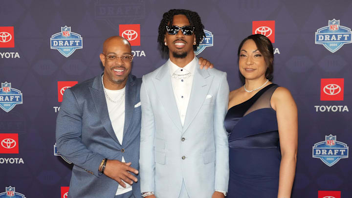 Jayden Daniels stands on the red carpet ahead of the 2024 NFL Draft.