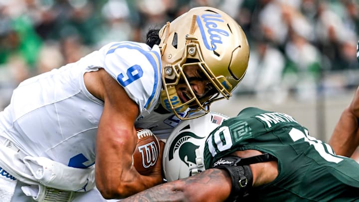 Michigan State's Wayne Matthews III, right, tackles UCLA's Nico Iamaleava during the second quarter on Saturday, Oct. 11, 2025, at Spartan Stadium in East Lansing.