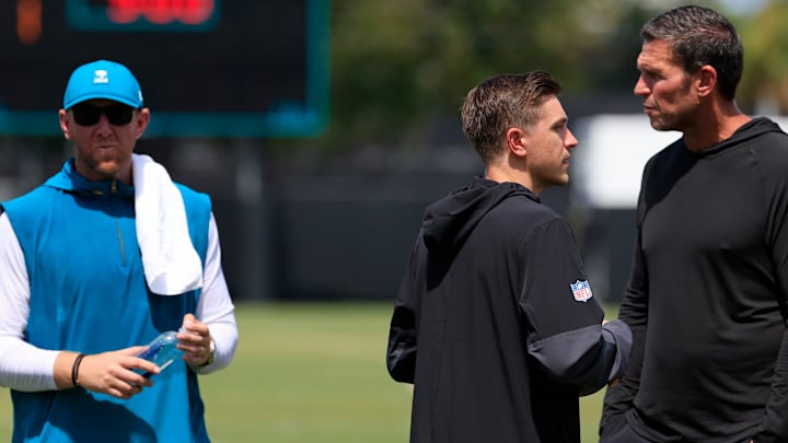 From left, Jacksonville Jaguars head coach Liam Coen, general manager James Gladstone and Tony Boselli, executive vice president of football operations, talk after an NFL training camp session at the Miller Electric Center, Thursday, Aug. 14, 2025 in Jacksonville, Fla.