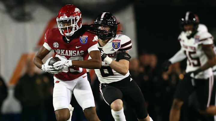 Arkansas Razorbacks wide receiver Dazmin James (83) runs after a catch during the second quarter against the Texas Tech Red Raiders at Simmons Bank Liberty Stadium. Arkansas Razorbacks wide receiver Dazmin James (83) runs after a catch during the second quarter against the Texas Tech Red Raiders at Simmons Bank Liberty Stadium.