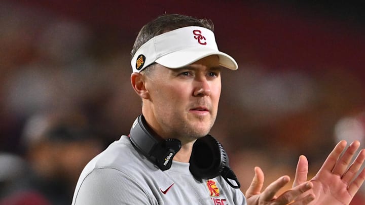 Oct 1, 2022; Los Angeles, California, USA;  USC Trojans head coach Lincoln Riley applauds after a touchdown in the first half against the Arizona State Sun Devils at United Airlines Field at the Los Angeles Memorial Coliseum. Mandatory Credit: Jayne Kamin-Oncea-Imagn Images