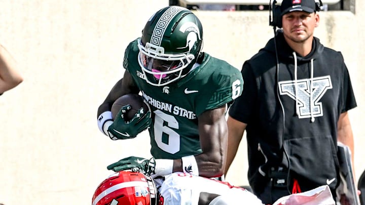 Michigan State's Nick Marsh, top, catches a pass as Youngstown State's Makai Shahid closes in during the first quarter on Saturday, Sept. 13, 2025, at Spartan Stadium in East Lansing.
