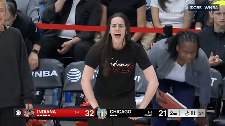 Clark reacts from the bench as the Indiana Fever play the Chicago Sky.