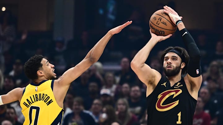 May 13, 2025; Cleveland, Ohio, USA; Cleveland Cavaliers guard Max Strus (1) shoots over the defense of  Indiana Pacers guard Tyrese Haliburton (0) during the first quarter of game five of the second round for the 2025 NBA Playoffs at Rocket Arena. Mandatory Credit: Ken Blaze-Imagn Images