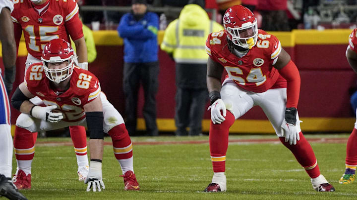 Dec 10, 2023; Kansas City, Missouri, USA; Kansas City Chiefs guard Joe Thuney (62) and offensive tackle Wanya Morris (64) at the line of scrimmage against the Buffalo Bills during the game at GEHA Field at Arrowhead Stadium. Mandatory Credit: Denny Medley-Imagn Images