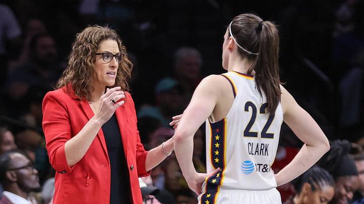 Indiana Fever head coach Stephanie White talks with guard Caitlin Clark (22) Indiana Fever head coach Stephanie White talks with guard Caitlin Clark (22)
