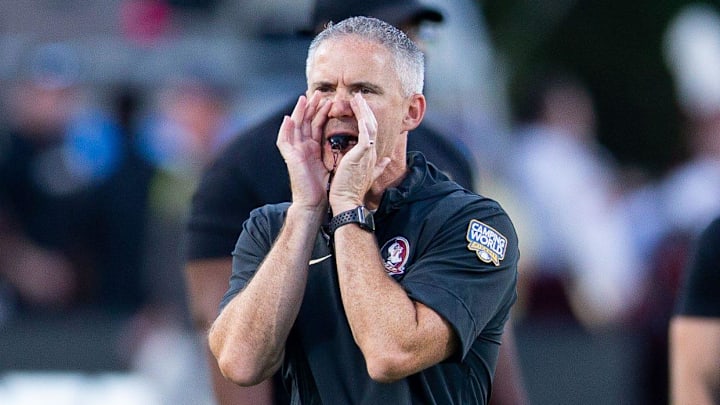 Florida State Seminoles head coach Mike Norvell leads warmups before the Seminoles take on the LSU Tigers on Sunday, Sept. 3, 2023 at Camping World Stadium.