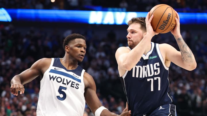 May 28, 2024; Dallas, Texas, USA; Dallas Mavericks guard Luka Doncic (77) dribbles against Minnesota Timberwolves guard Anthony Edwards (5) during the third quarter of game four of the western conference finals for the 2024 NBA playoffs at American Airlines Center. Mandatory Credit: Kevin Jairaj-USA TODAY Sports