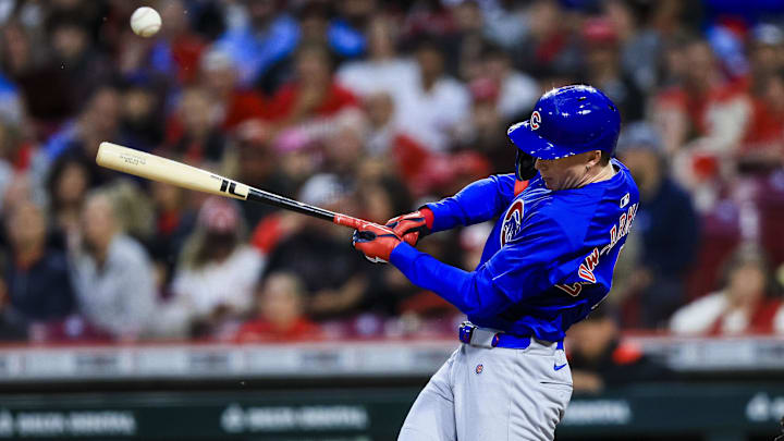 May 23, 2025; Cincinnati, Ohio, USA; Chicago Cubs outfielder Pete Crow-Armstrong (4) hits a double in the sixth inning against the Cincinnati Reds at Great American Ball Park.