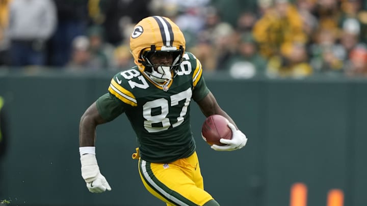 Nov 23, 2025; Green Bay, Wisconsin, USA; Green Bay Packers wide receiver Romeo Doubs (87) carries the ball Minnesota Vikings during the second half at Lambeau Field. Mandatory Credit: Kayla Wolf-Imagn Images
