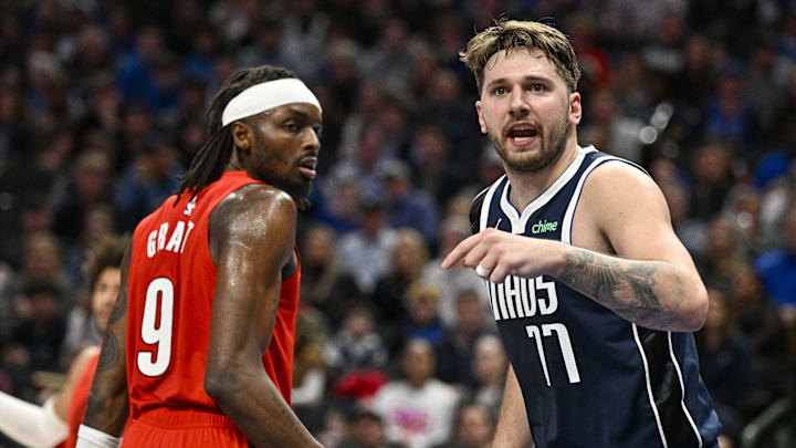 Jan 3, 2024; Dallas, Texas, USA; Dallas Mavericks guard Luka Doncic (77) argues a call as Portland Trail Blazers forward Jerami Grant (9) looks on during the second half at the American Airlines Center. Mandatory Credit: Jerome Miron-Imagn Images