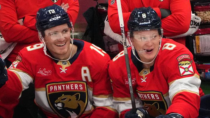 Sep 20, 2026; Sunrise, Florida, USA;  Florida Panthers left wing Matthew Tkachuk (19) and his brother, left wing Brady Tkachuk (8), sit on the bench during the third period against the Carolina Hurricanes at Amerant Bank Arena.  Mandatory Credit: Jim Rassol-Imagn Images