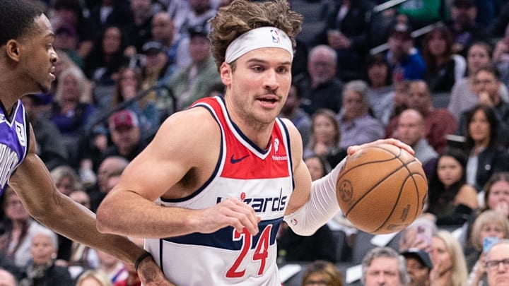 Jan 19, 2025; Sacramento, California, USA; Washington Wizards forward Corey Kispert (24) drives to the basket against Sacramento Kings guard De'Aaron Fox (5) during the first quarter at Golden 1 Center. Mandatory Credit: Ed Szczepanski-Imagn Images Jan 19, 2025; Sacramento, California, USA; Washington Wizards forward Corey Kispert (24) drives to the basket against Sacramento Kings guard De'Aaron Fox (5) during the first quarter at Golden 1 Center. Mandatory Credit: Ed Szczepanski-Imagn Images