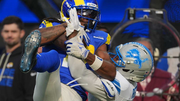 Los Angeles Rams wide receiver Davante Adams (17) catches a pass against Detroit Lions cornerback D.J. Reed (4) Los Angeles Rams wide receiver Davante Adams (17) catches a pass against Detroit Lions cornerback D.J. Reed (4)