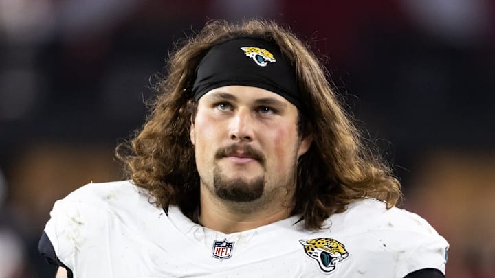 Nov 23, 2025; Glendale, Arizona, USA; Jacksonville Jaguars offensive lineman Jonah Monheim (60) against the Arizona Cardinals at State Farm Stadium. Mandatory Credit: Mark J. Rebilas-Imagn Images