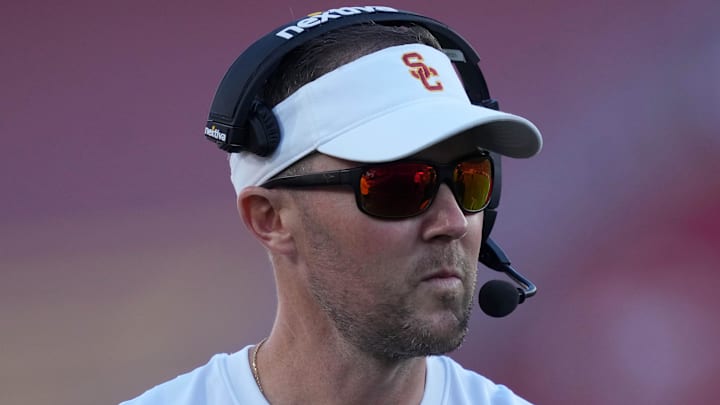 Oct 21, 2023; Los Angeles, California, USA; Southern California Trojans head coach Lincoln Riley watches from the sidelines against the Utah Utes in the first half at United Airlines Field at Los Angeles Memorial Coliseum. Mandatory Credit: Kirby Lee-Imagn Images Oct 21, 2023; Los Angeles, California, USA; Southern California Trojans head coach Lincoln Riley watches from the sidelines against the Utah Utes in the first half at United Airlines Field at Los Angeles Memorial Coliseum. Mandatory Credit: Kirby Lee-Imagn Images