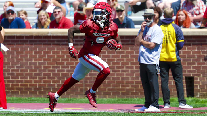 Oklahoma running back Tory Blaylock carries the ball at the Crimson Combine. Oklahoma running back Tory Blaylock carries the ball at the Crimson Combine.