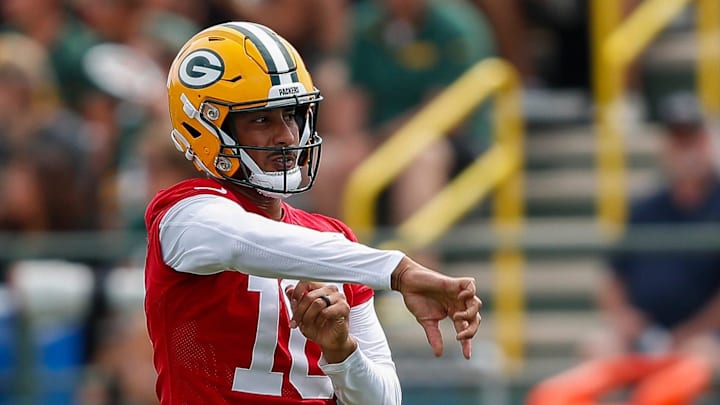 Green Bay Packers quarterback Jordan Love follows through on his release at training camp.