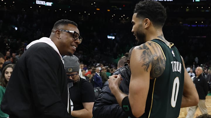 Oct 18, 2022; Boston, Massachusetts, USA; Boston Celtics forward Jayson Tatum (0) talks with former Celtics great Paul Pierce after they defeated the Philadelphia 76ers at TD Garden. Mandatory Credit: Winslow Townson-Imagn Images