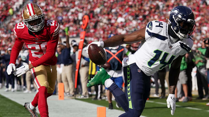 Dec 10, 2023; Santa Clara, California, USA; Seattle Seahawks wide receiver DK Metcalf (14) catches a touchdown in front of San Francisco 49ers cornerback Ambry Thomas (20) in the first quarter at Levi's Stadium. Images