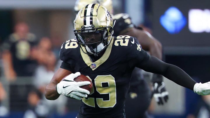 Sep 15, 2024; Arlington, Texas, USA; New Orleans Saints cornerback Paulson Adebo (29) intercepts a ball intended for Dallas Cowboys wide receiver Jalen Brooks (not pictured) during the first half at AT&T Stadium. Mandatory Credit: Kevin Jairaj-Imagn Images Sep 15, 2024; Arlington, Texas, USA; New Orleans Saints cornerback Paulson Adebo (29) intercepts a ball intended for Dallas Cowboys wide receiver Jalen Brooks (not pictured) during the first half at AT&T Stadium. Mandatory Credit: Kevin Jairaj-Imagn Images