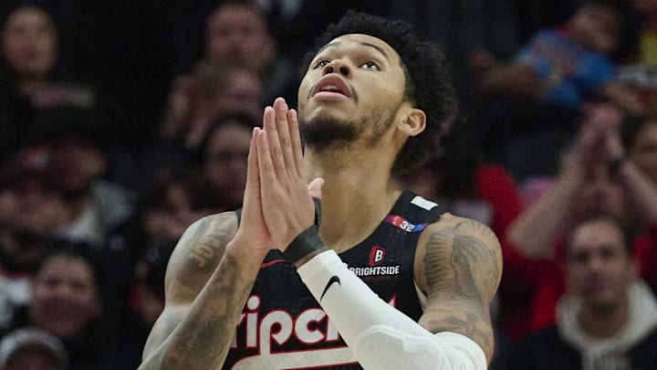 Jan 11, 2025; Portland, Oregon, USA; Portland Trail Blazers guard Anfernee Simons (1) reacts after being fouled and scoring a basket during the second half against the Miami Heat at Moda Center. Mandatory Credit: Troy Wayrynen-Imagn Images