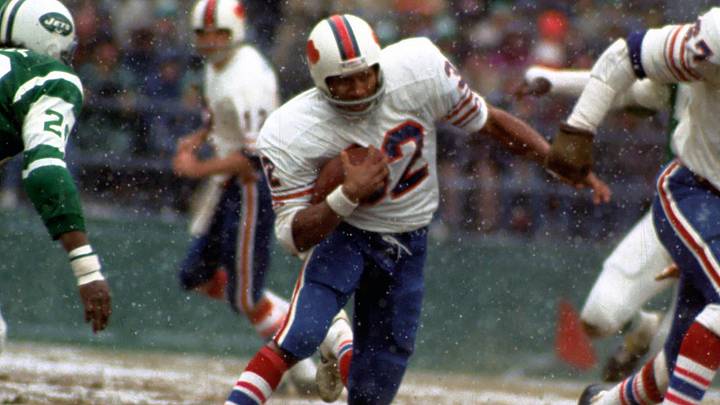 Buffalo Bills running back O.J. Simpson breaks the single season NFL rushing with 2003 yards against the New York Jets.