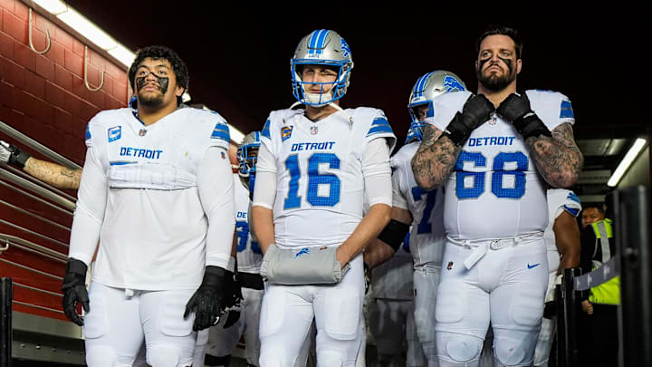 Detroit Lions offensive tackle Penei Sewell (58), quarterback Jared Goff (16) and offensive tackle Taylor Decker (68)