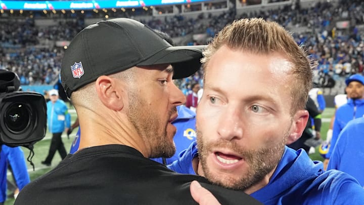 Jan 10, 2026; Charlotte, NC, USA; Los Angeles Rams head coach Sean McVay and Carolina Panthers head coach Dave Canales meet after the game in the NFC Wild Card Round game at Bank of America Stadium. Mandatory Credit: Bob Donnan-Imagn Images