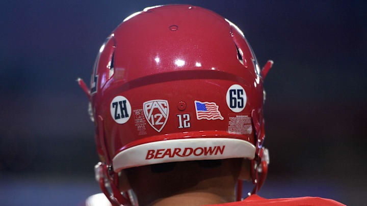 Sep 3, 2016; Glendale, AZ, USA; Stickers on the the helmet of Arizona Wildcats quarterback Anu Solomon depict the number 65 and the letters ZH for deceased player Zach Hemmila (not pictured) prior to the game against the Brigham Young Cougars at University of Phoenix Stadium. Mandatory Credit: Joe Camporeale-Imagn Images