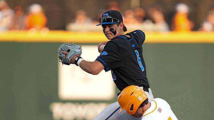 Kentucky infielder Tyler Bell (6) throws the ball to first base after getting Tennessee infielder Andrew Fischer (11) out at second base during a NCAA baseball game between Tennessee and Kentucky at Lindsey Nelson Stadium in Knoxville, Tenn., on April 18, 2025. Kentucky infielder Tyler Bell (6) throws the ball to first base after getting Tennessee infielder Andrew Fischer (11) out at second base during a NCAA baseball game between Tennessee and Kentucky at Lindsey Nelson Stadium in Knoxville, Tenn., on April 18, 2025.