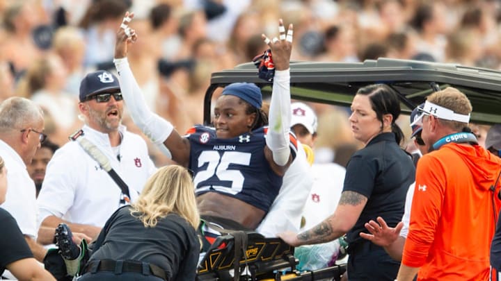 Auburn Tigers defensive back Champ Anthony (25) acknowledges the crowd as he is carted off the field with an injury as Auburn Tigers take on Arkansas Razorbacks at Jordan-Hare Stadium in Auburn, Ala., on Saturday, Sept. 21, 2024. Arkansas Razorbacks lead Auburn Tigers 7-0 at halftime. Auburn Tigers defensive back Champ Anthony (25) acknowledges the crowd as he is carted off the field with an injury as Auburn Tigers take on Arkansas Razorbacks at Jordan-Hare Stadium in Auburn, Ala., on Saturday, Sept. 21, 2024. Arkansas Razorbacks lead Auburn Tigers 7-0 at halftime.