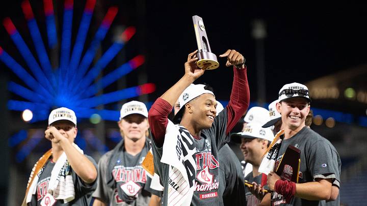 Oklahoma Sooners pitcher LJ Mercurius (22) celebrates with teammates after the win against the North Carolina Tar Heels at Charles Schwab Field.