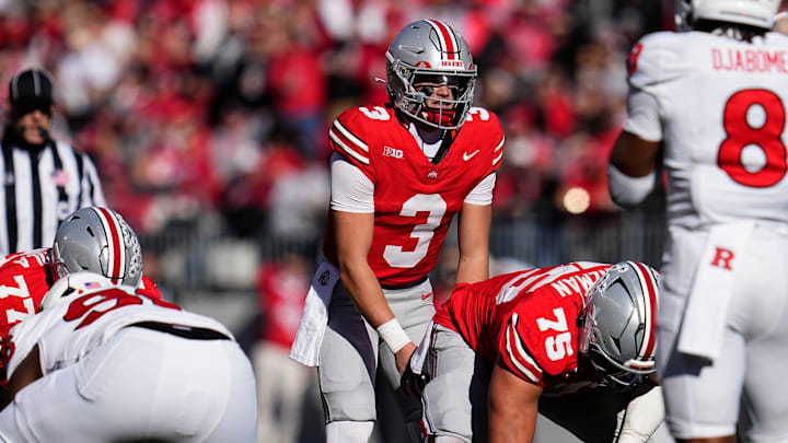 Ohio State Buckeyes quarterback Lincoln Kienholz (3) takes a snap during the NCAA football game against the Rutgers Scarlet Knights at Ohio Stadium in Columbus on Nov. 22, 2025. Ohio State won 42-9. Ohio State Buckeyes quarterback Lincoln Kienholz (3) takes a snap during the NCAA football game against the Rutgers Scarlet Knights at Ohio Stadium in Columbus on Nov. 22, 2025. Ohio State won 42-9.