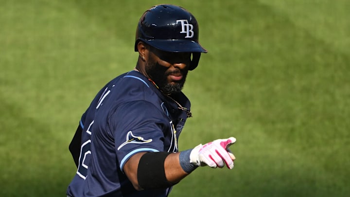 Tampa Bay Rays first baseman Yandy Diaz (2) celebrates while rounding the bases after hitting a home run during the fourth inning against the Baltimore Orioles at Oriole Park at Camden Yards. 