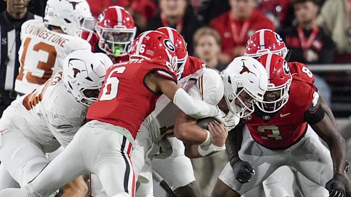 Nov 15, 2025; Athens, Georgia, USA; Georgia Bulldogs defensive back Daylen Everette (6) tackles Texas Longhorns quarterback Arch Manning (16) in the first half at Sanford Stadium. Mandatory Credit: Dale Zanine-Imagn Images Nov 15, 2025; Athens, Georgia, USA; Georgia Bulldogs defensive back Daylen Everette (6) tackles Texas Longhorns quarterback Arch Manning (16) in the first half at Sanford Stadium. Mandatory Credit: Dale Zanine-Imagn Images