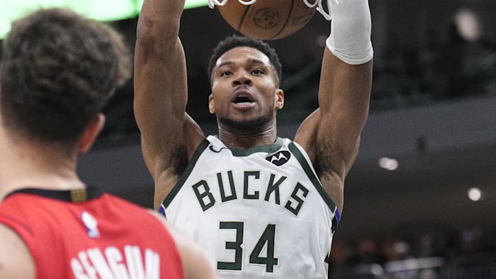Nov 9, 2025; Milwaukee, Wisconsin, USA; Milwaukee Bucks forward Giannis Antetokounmpo (34) dunks the ball againtst Houston Rockets center Alperen Sengun (28) in the second half at Fiserv Forum. Mandatory Credit: Michael McLoone-Imagn Images
