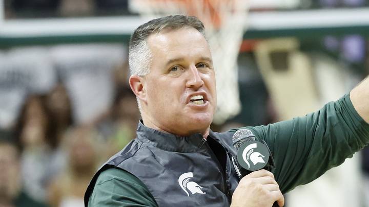Michigan State Spartans head football coach Pat Fitzgerald points while introducing himself to the crowd at a men's basketball game against the Iowa Hawkeyes on Tuesday, Dec. 2, 2025. Fitzgerald was officially hired by MSU on Monday. Michigan State Spartans head football coach Pat Fitzgerald points while introducing himself to the crowd at a men's basketball game against the Iowa Hawkeyes on Tuesday, Dec. 2, 2025. Fitzgerald was officially hired by MSU on Monday.