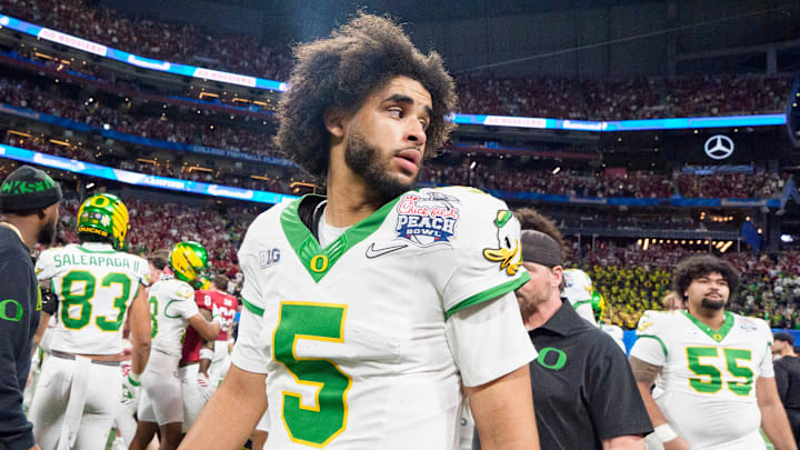 Oregon quarterback Dante Moore walks the field after the Ducks’ loss as the Oregon Ducks face the Indiana Hoosiers in the Peach Bowl on Jan. 9, 2026, at Mercedes-Benz Stadium in Atlanta, Georgia.