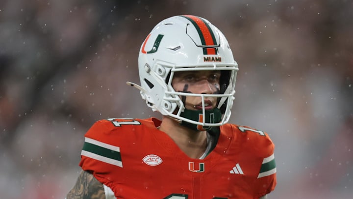 Sep 20, 2025; Miami Gardens, Florida, USA; Miami Hurricanes quarterback Carson Beck (11) runs on the field before the game against the Florida Gators at Hard Rock Stadium. Mandatory Credit: Sam Navarro-Imagn Images