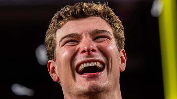 Indiana's Fernando Mendoza (15) smiles on the podium after the College Football Playoff National Championship college football game at Hard Rock Stadium in Miami Gardens on Monday, Jan. 19, 2026. Indiana's Fernando Mendoza (15) smiles on the podium after the College Football Playoff National Championship college football game at Hard Rock Stadium in Miami Gardens on Monday, Jan. 19, 2026.